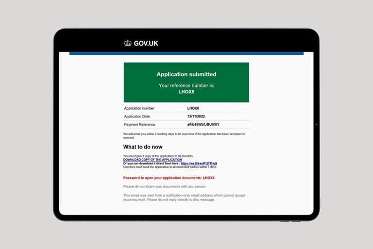 Person reporting benefit fraud online using the GOV.UK website on a laptop
